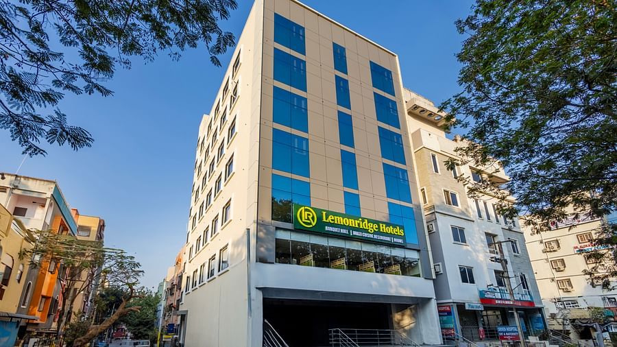 Lemonridge Hotels, KPHB | Exterior daytime view of the hotel building. Street level perspective with signage.